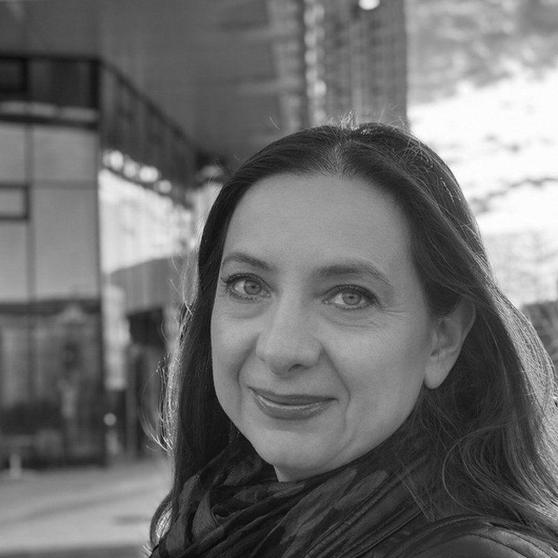 Portrait of Nadia Muradi, in black and white.