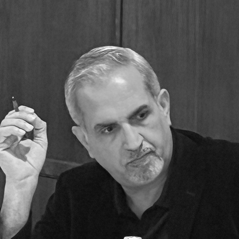 Portrait of Samer Khwaiss, in black and white.